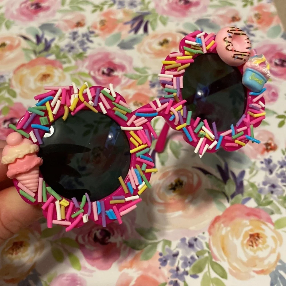 Girls hot pink flower shaped sprinkle sunglasses